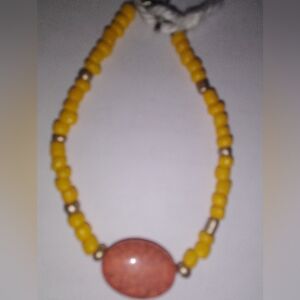 Handcrafted Yellow Beaded Necklace with Coral Accent